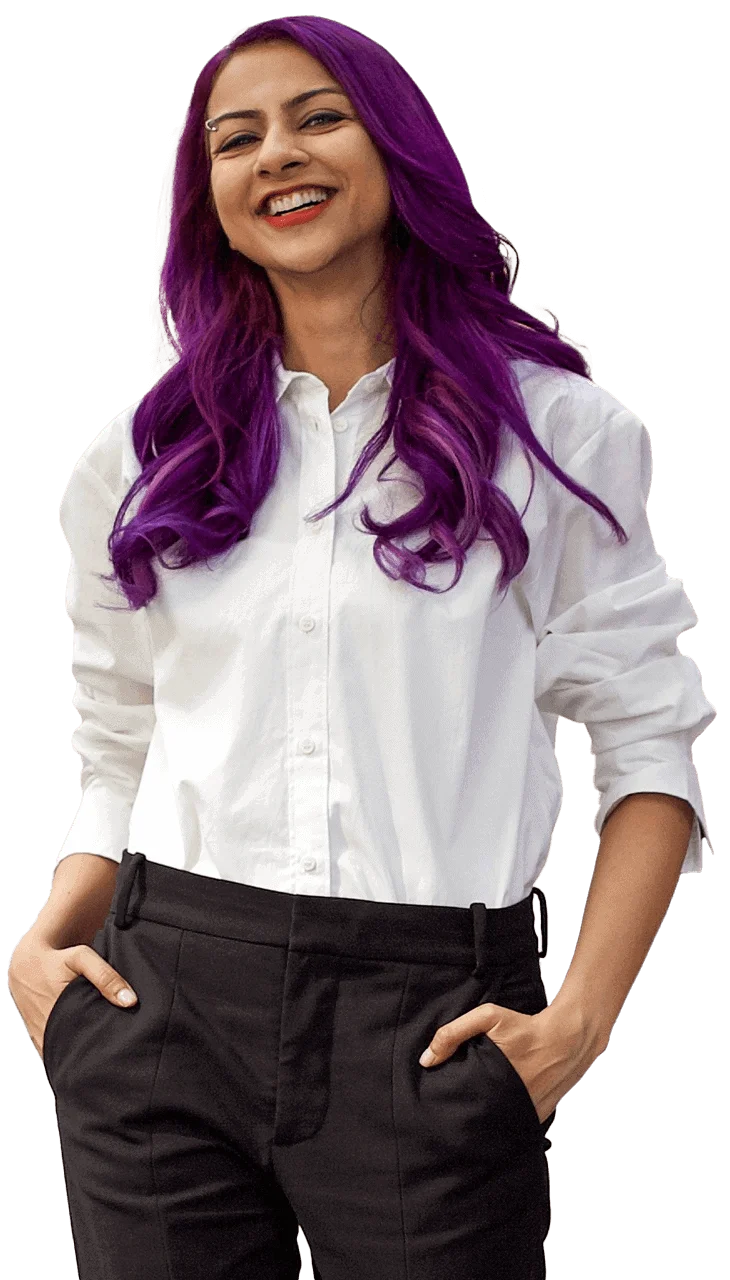 Nausheen I. Chen standing and smiling with hands in pockets