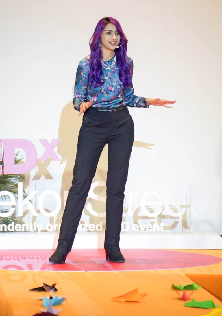 Nausheen speaking publicly on stage