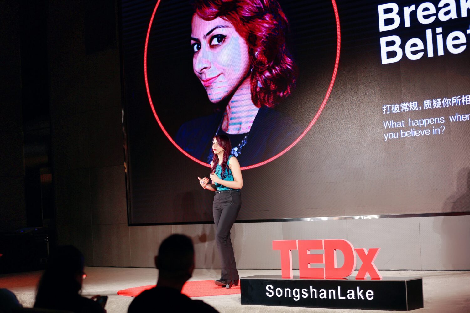Naushen Chen speaking on TEDx stage
